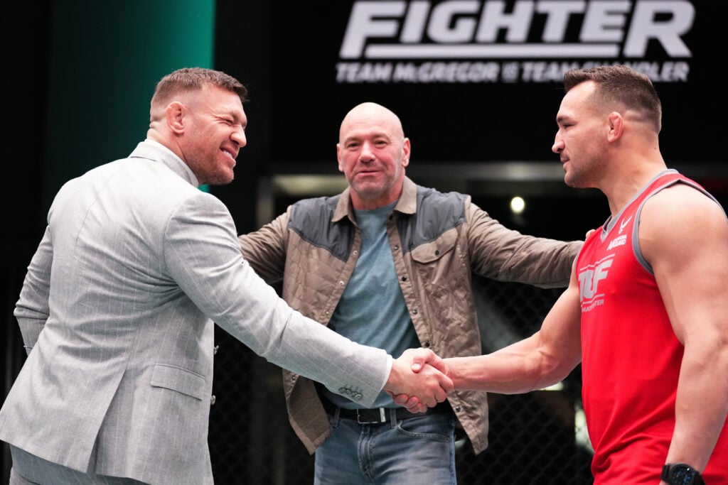 (L-R) Conor McGregor and Michael Chandler shake hands during the taping of The Ultimate Fighter at UFC APEX on March 13, 2023 in Las Vegas, Nevada.