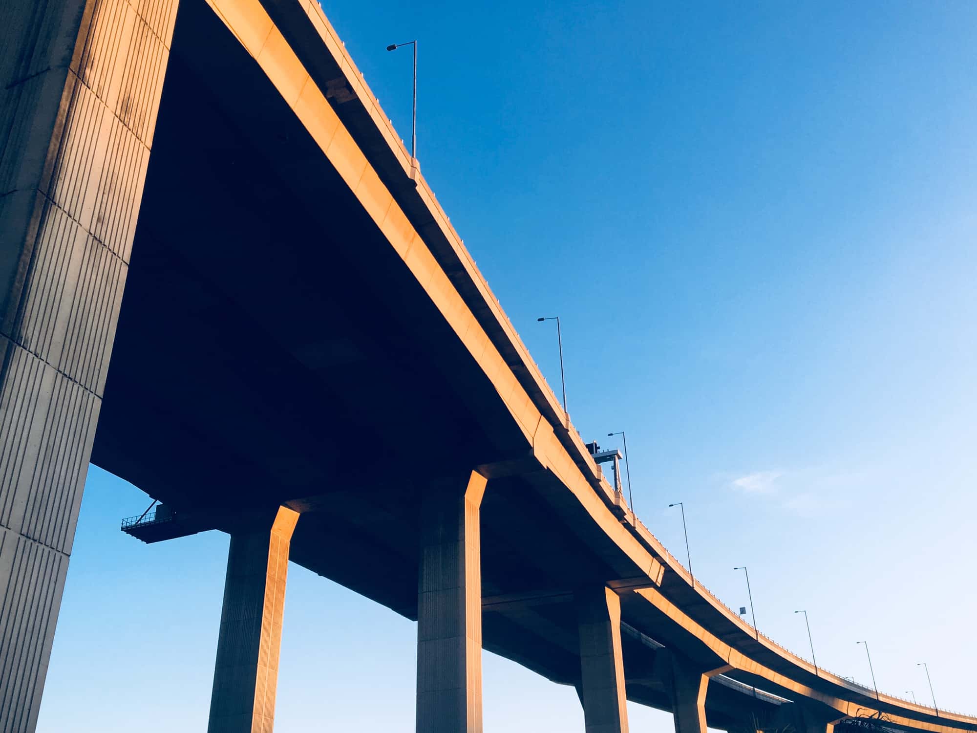 Low angle view of the bridge against the clear blue sky - stock photo/Getty Images