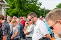 Prayer to start an emotional rally to save Mason Rudolph Golf Course Rally. May 31, 2024 (Jeff Danault)