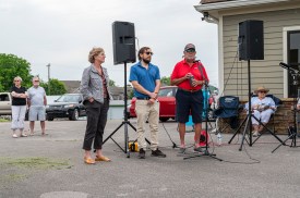 Karen Reynolds, Travis Holleman and Freddy Langford at the Save Mason Rudolph golf course rally. May 31, 2024 (Jeff Danault)