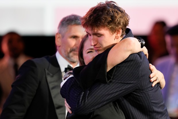 Matas Buzelis hugs family and friends after being selected by the Chicago Bulls as the 11th pick during the first round of the NBA basketball draft, Wednesday, June 26, 2024, in New York.  (AP Photo/Julia Nikhinson)