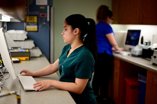 Nurse Ashely Arce works at the Doctors Care clinic in Littleton on Thursday, May 30, 2024. (Photo by Hyoung Chang/The Denver Post)