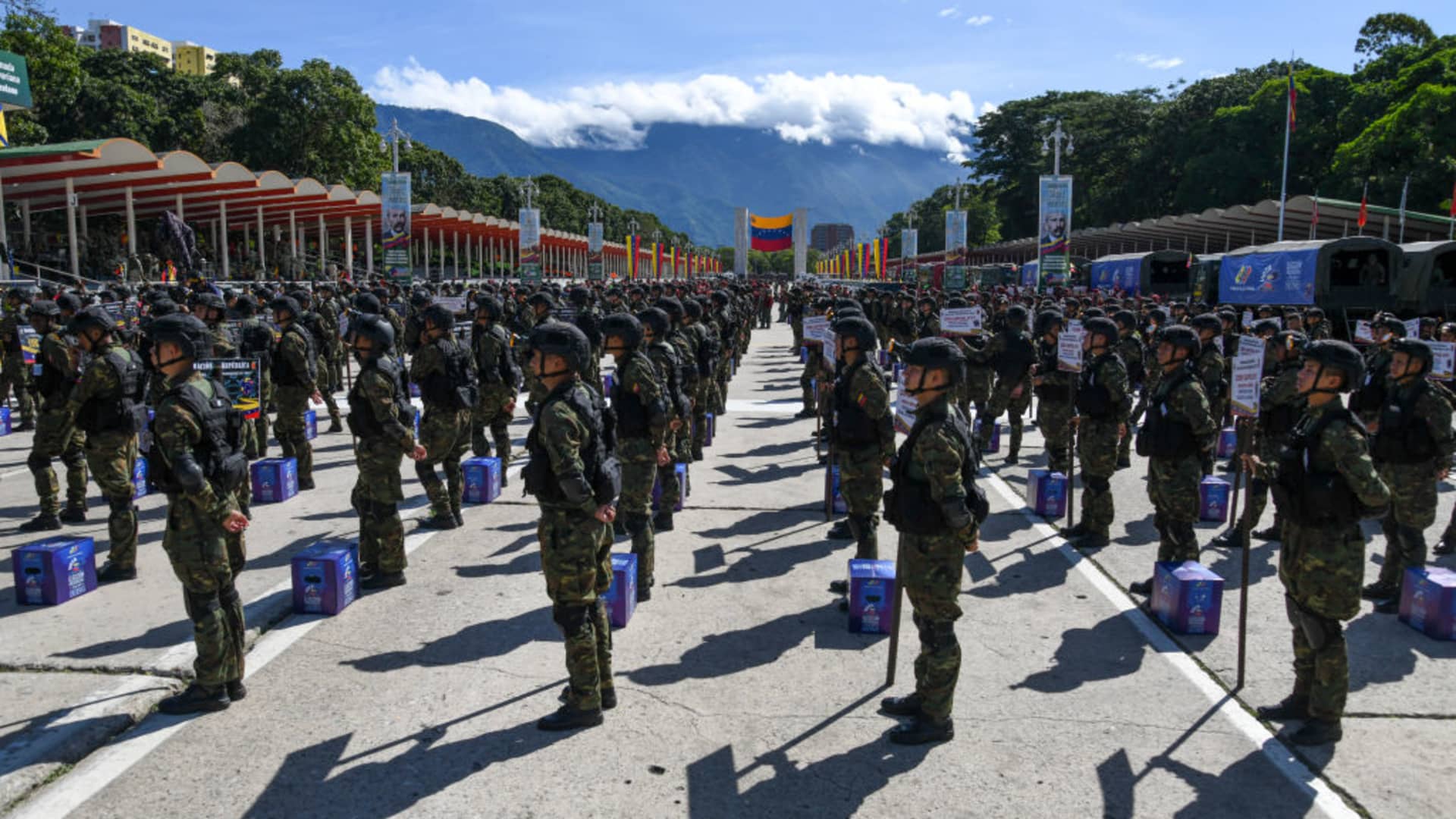 Army soldiers stand next to ballot boxes as they participate in a military parade displaying electoral material to be used in the upcoming presidential elections at Fuerte Tiuna in Caracas on July 24, 2024. Venezuela will hold presidential elections on July 28, 2024.