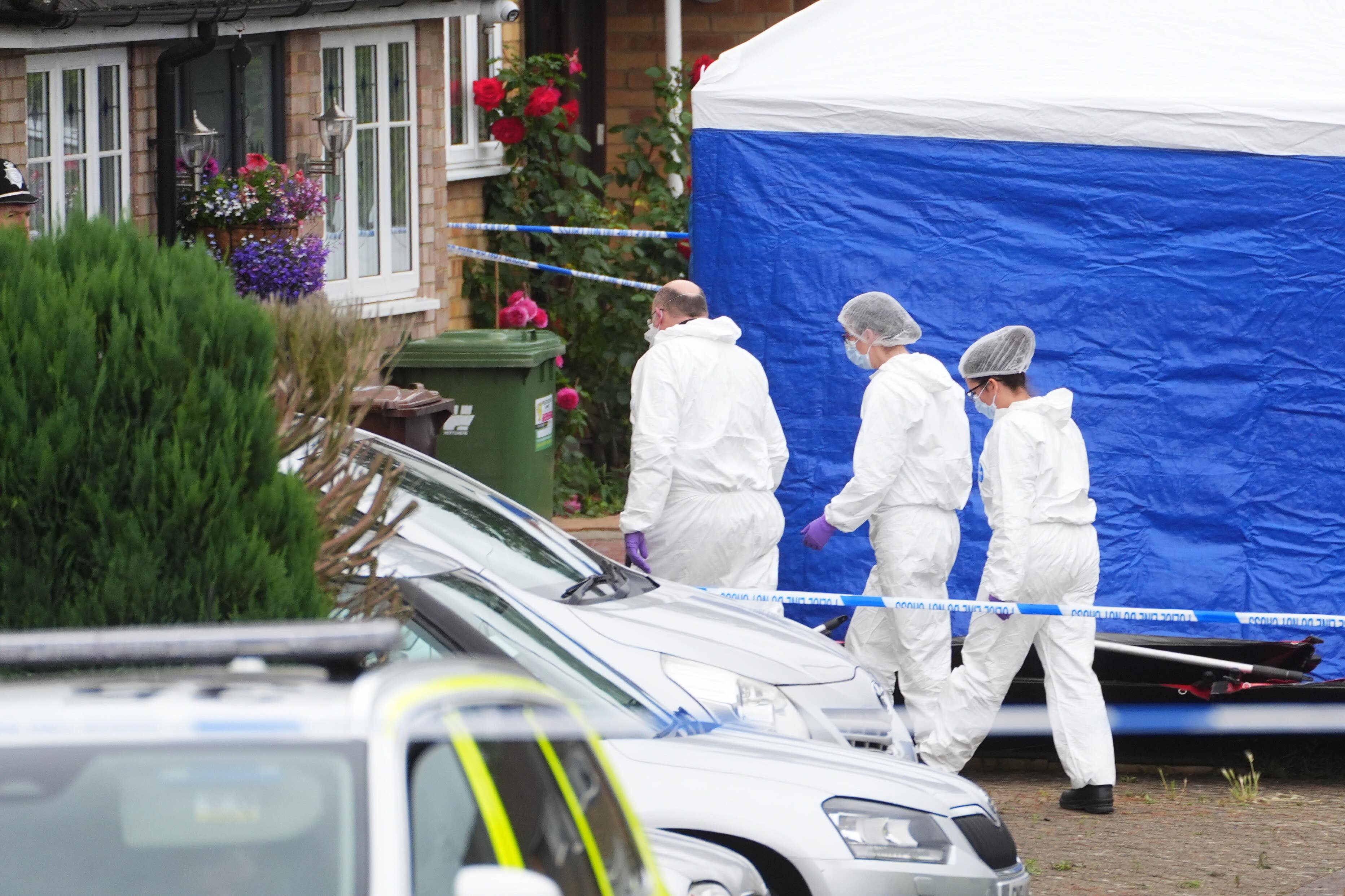 Forensic officers at the scene in Ashlyn Close